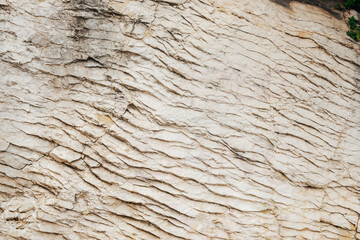 Beige rock or stone background, texture