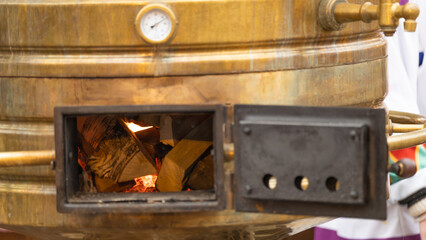 Vintage metal copper tea samovar. Front view with firebox window and pressure gauge. Russian...