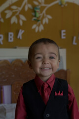 portrait of elegant little boy gesturing