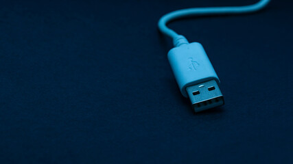 white usb cable  on black background