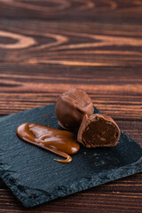 chocolates with salted caramel. Melted caramel candies and caramel sauce with a salt. Close up Gourmet salted caramel truffles