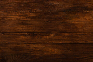 Fototapeta na wymiar Vintage brown wood background texture with knots and nail holes. Old painted wood wall. Wooden dark horizontal boards