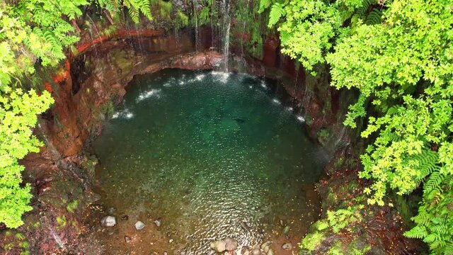 Aerial 4K footage of 25 fontes falls in Madeira island. Many small waterfalls coming to a miniature lake in a middle of jungle