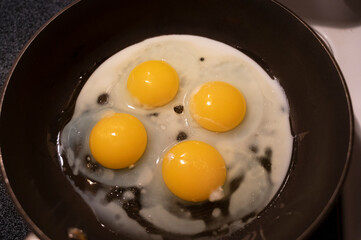 eggs in frying pan. Eggs frying in pan for breakfast 