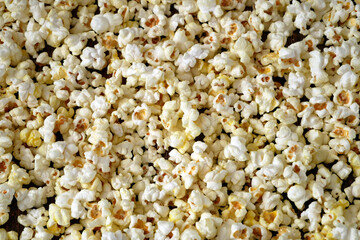 tasty popcorn background top view, abstract corn texture