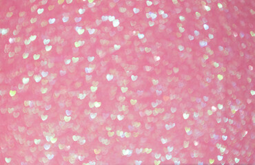 Defocus light pink Background. Hearts Bokeh with blick. Glitter pink background.