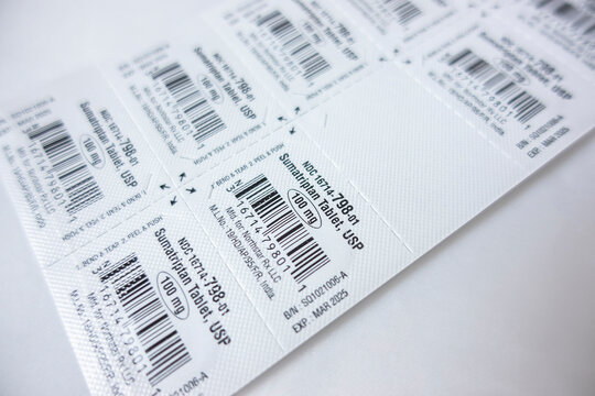 Seattle, WA USA - circa December 2021: Selective focus view of a blister pack of sumatriptan migraine medication on a white background.