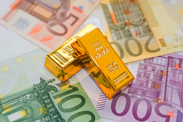 Gold bars on the background of euro banknotes