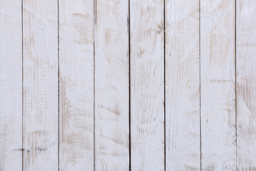 Vintage white wood background texture with knots and nail holes. Old painted wood wall.