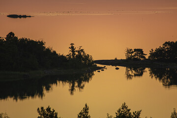 Early summer dawn over the sea. Nature of Scandinavia. islands in the sea. Finland. Turku Archipelago.