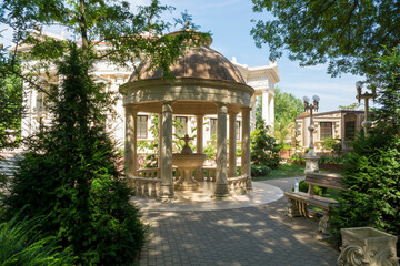 Stone gazebo in the old style with a fountain in the old park of the village of Kabardinka of the...