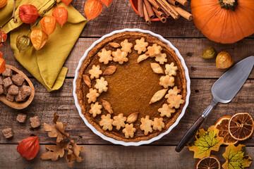 Pumpkin Pie. Tart with whipped cream and cinnamon on rustic background. Traditional american homemade pumpkin cake for Thanksgiving or Halloween Ready to eat. Mock up.