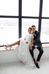 Romantic meeting of the bride and groom. The morning before the wedding. Filming in the hotel lobby.