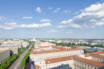 Pennsylvania Street and major monumental buildings including US Capitol in a cloudy day -...