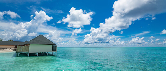 Beautiful beach with water bungalows at Maldives