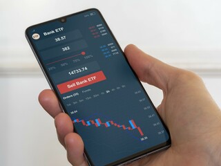 Stock exchange market chart, Stock market data on smartphone. Business analysis of an bank ETF