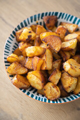 Roasted potatoes served in bowl