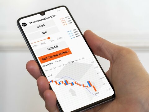 Stock exchange market chart, etf shares market datas on phone. Business analysis of an transportation ETF
