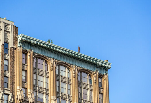 Statue Of Man From Artist Antony Gormley On The Roof