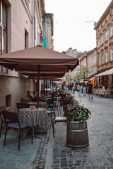 Cafe in the center in old city center of Lviv on a summer sunny day
