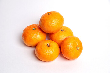 Several tangerines on a blue background.