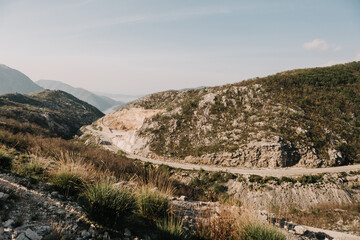 mountain road winding towards sea beautiful scenery