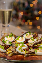 Toasted bread with sprats, eggs and herbs. Traditional Russian food for the New Year's table
