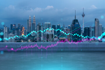 Naklejka premium Rooftop with concrete terrace, Kuala Lumpur night skyline. Forecasting and business modeling of financial markets hologram digital charts. City downtown. Double exposure.