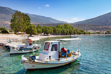 Fototapeta na wymiar Fishing boats at the beach Saranti, Greece