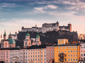 Fototapeta na wymiar Urban street view and the Hohensalzburg Castle in the background, Salzburg, Austria
