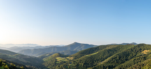 Panoramic view of mountains at sunrise from O Cebreriro in Pedrafita de Cebreiro in Lugo, Spain at...