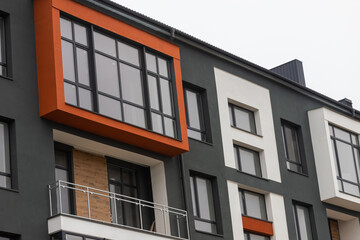 Fragment of Modern residential apartment with flat buildings exterior. Detail of New luxury house and home complex. Part of City Real estate property and condo architecture. Copy space