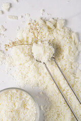 Tools and supply for candle-making: wicks, soy and coconut wax, gold foil, colors and aroma oils, bubble candle