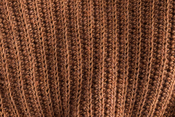 Caramel crochet geometric texture background.