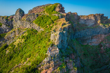 Fototapeta premium Aerial view of the mountains range in Madeira Island with a views balcony on a trail between Pico Ruivo and Pico Areeiro peaks