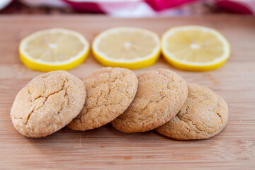 Delicious lemon sugar cookies with crinkled tops; display of home made lemon cookies