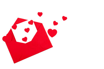 Red envelope with a white sheet of paper and red hearts on a white background. Valentine's day greeting card.