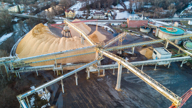 Aerial view of a huge factory facility in Austria during sunset.