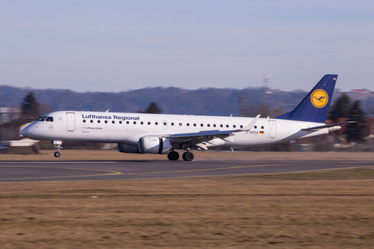 Lufthansa Embraer jet with open engine reservers on the runway