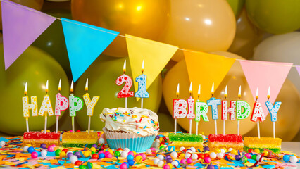 Cream cake with a candle for twenty-one years, Greeting colorful card happy birthday 21 years old, birthday cupcake with candles and birthday decorations
