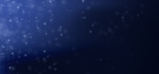 Abstract background of blue dot dust particles on deep sea light. White dots lens flare wallpaper of cosmos dark gradient underwater