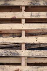 Full frame close-up view of a wooden transport pallet leaning against a wall