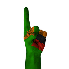 Hand pointing thumb up direction, zambia painted with flag as symbol of up direction, first and...