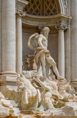 Mythical Oceanus and titan statues on Fontana di Trevi Fountain in front of Palazzo Poli Palace in Trevi quarter of historic Old Town city center of Rome in Italy