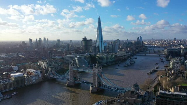 Aerial drone video of iconic Tower Bridge Tower of London and skyline in financial area of City of London, United Kingdom