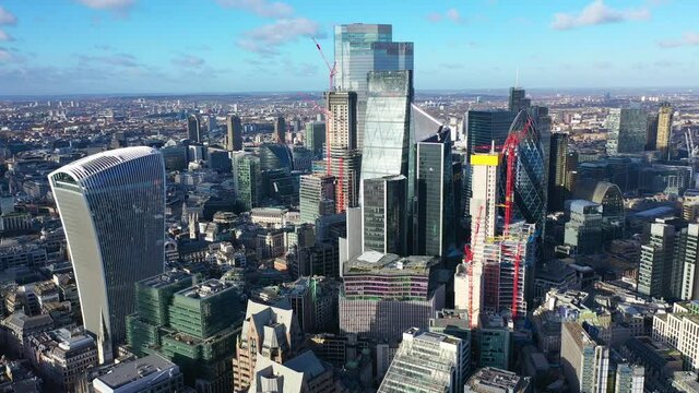 Aerial drone video of iconic landmark skyline skyscraper buildings in financial area of City of London, United Kingdom