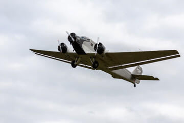 Fototapeta na wymiar an old three-engine airliner in flight, the Ju 52