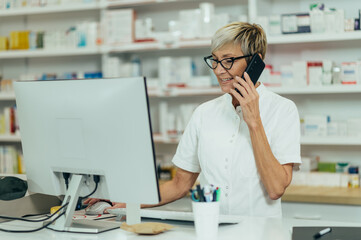 Portrait of a beautiful senior female pharmacist working in a pharmacy