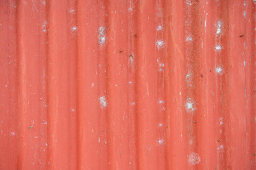 Naklejka na ściany i meble Red sheet metal, old, stained, corrugated with vertical lines. roofing