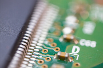 Electronic board with radio parts and chip processor from electronic device. Selective focus.